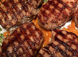 Pastured Cuban Pork Chops On A Bed Of Grilled Organic Orange Peppers and Thyme